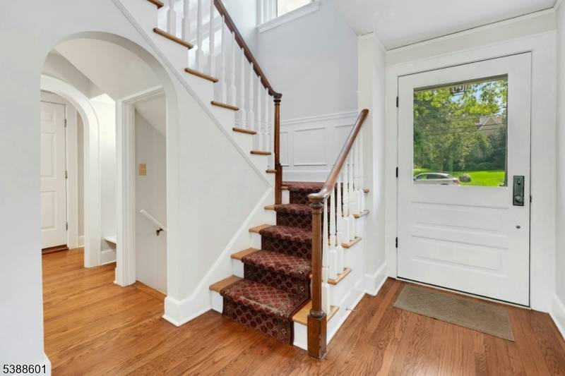 Welcome to this classic 1931 Center Hall Colonial, nestled on a beautifully landscaped and level 0.
