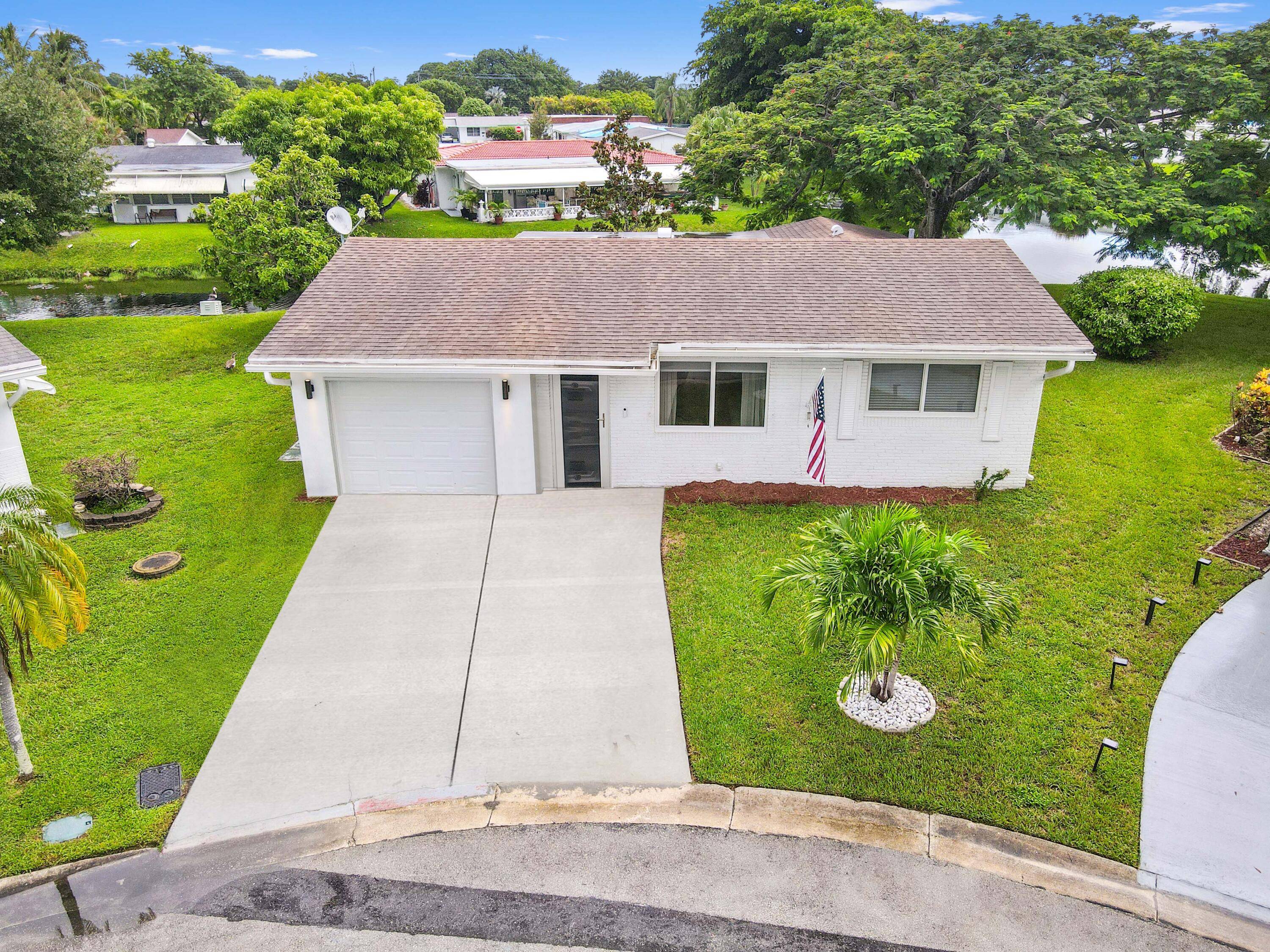 Welcome to this beautifully upgraded 1 story home in the desirable Paradise Gardens 55 community.