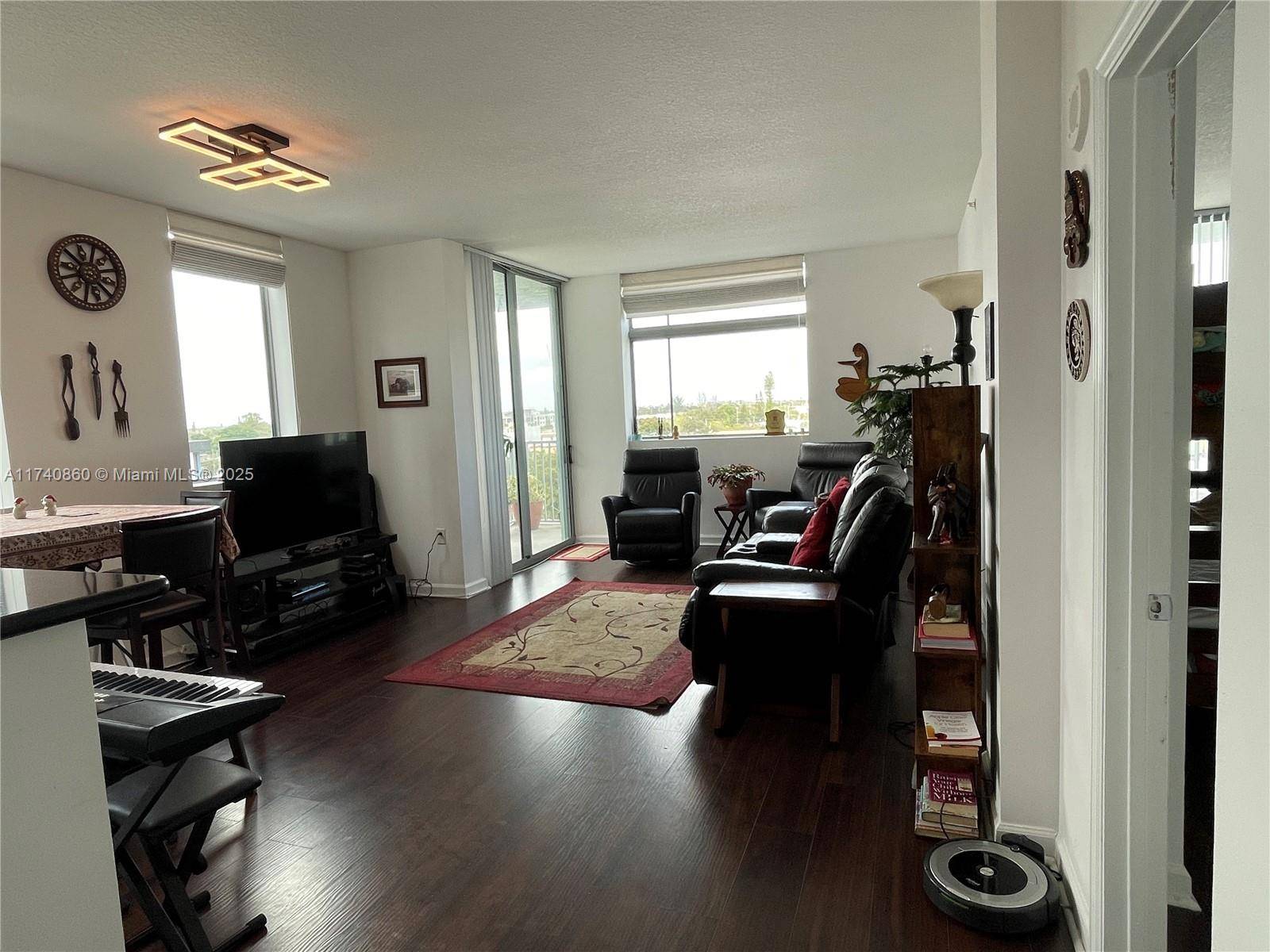 Welcome to this stunning corner unit located in Hollywood Station, featuring the largest floor plan in the building.