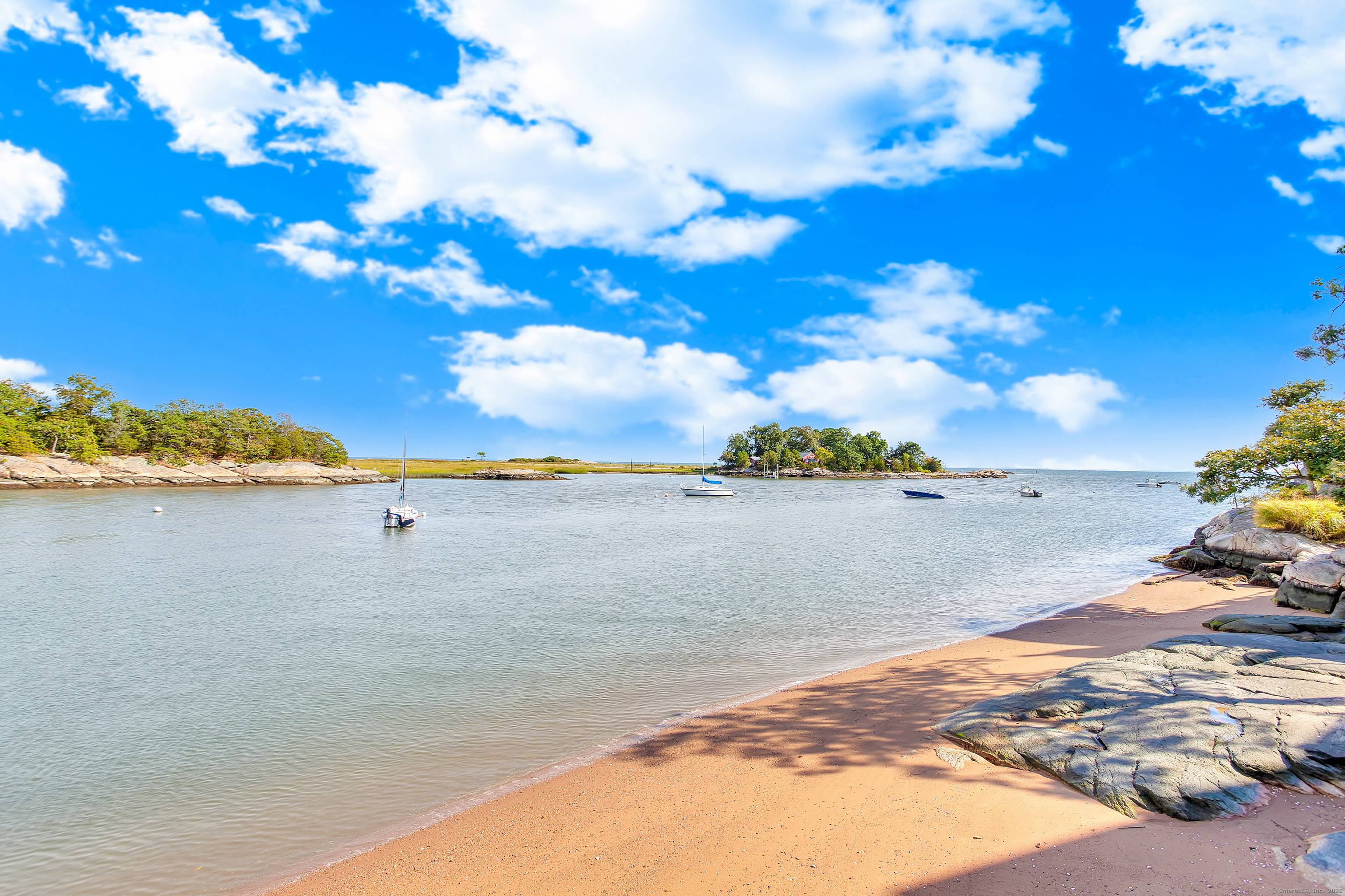 DISCOVER WHALERS POINT ! This small, water oriented community only 32 units, is nestled along the mouth of the Farm River and L.