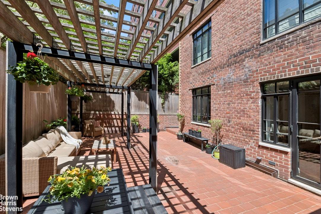 A Spectacular Garden Oasis in the Heart of Greenwich Village Welcome to a rare and unique home that combines townhouse charm with full service condo living.