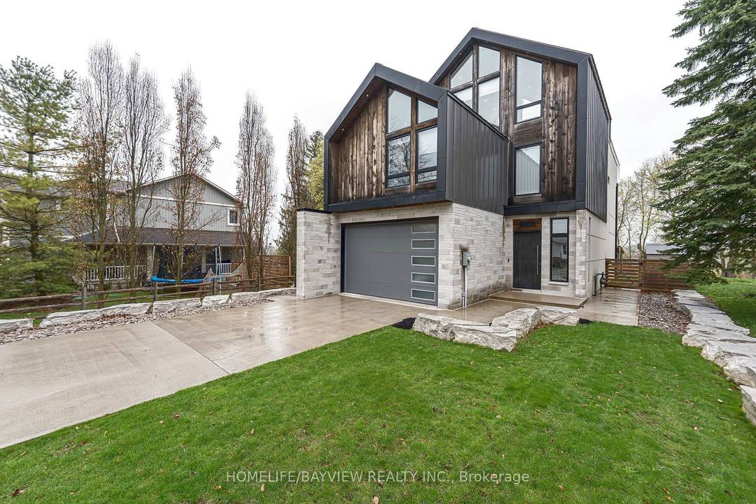 magnificent custom built 6 year new home overlooking Musselman Lake with picturesque panoramic views of nature and water.