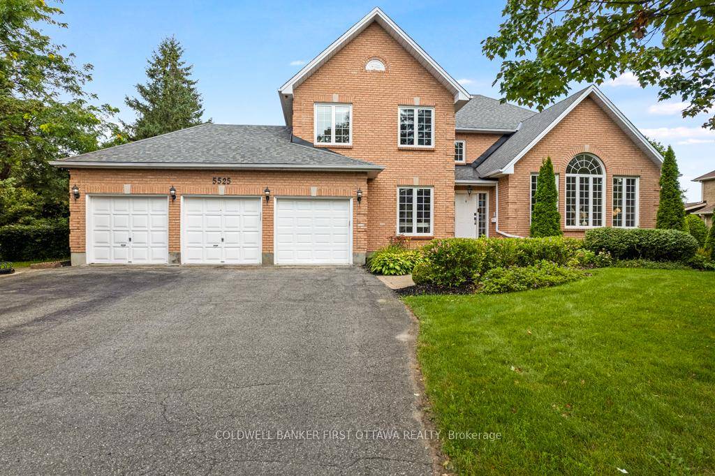 On quiet treed crescent, elegant all brick home with grand light filled rooms.