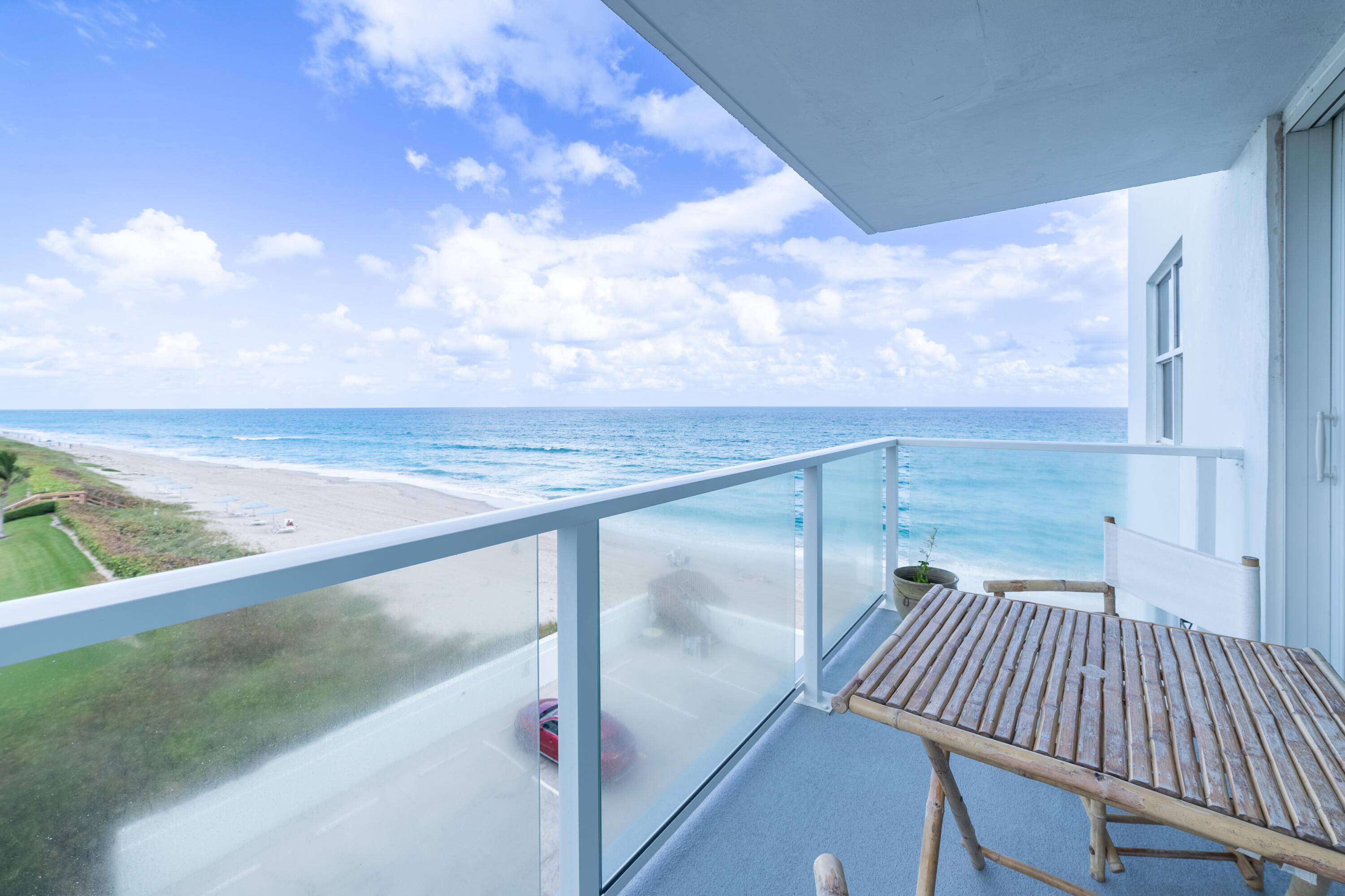 This stunning direct oceanfront corner unit boasts breathtaking views of the ocean from every room.