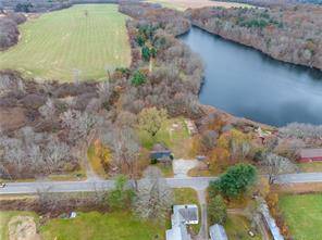 Private 4. 2 acre waterfront lot with over 700' water frontage see attachments on Windham Pond.