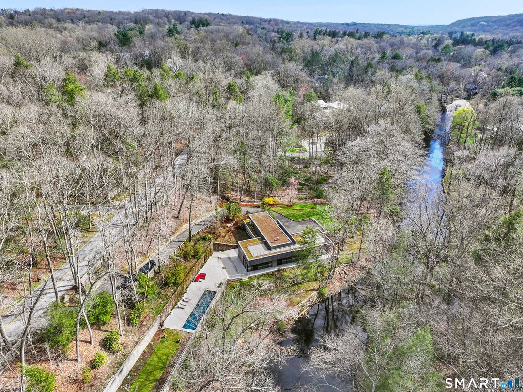 Set on three private acres of serene woodland along the banks of the Saugatuck River, this extraordinary Riverfront Retreat offers a rare opportunity to live immersed in nature in a ...