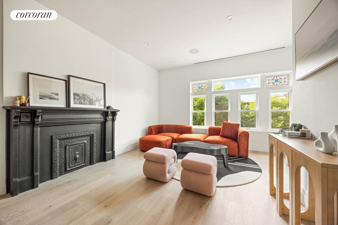 Perched on the top two floors of this historic Brownstone, a spacious 1, 108 sqft, three bedroom, two bathroom duplex condo with a private terrace, set in a newly converted ...