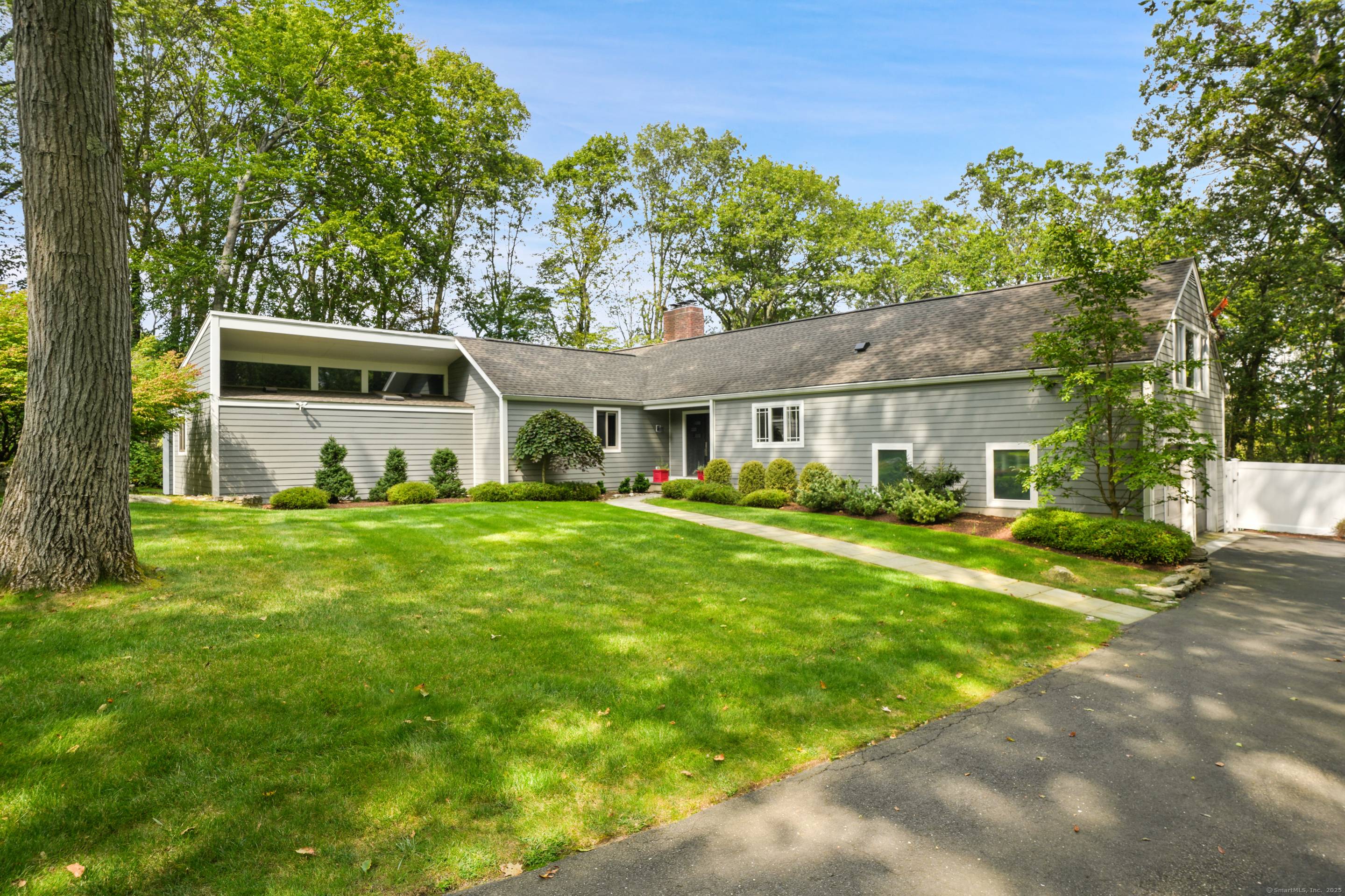 Discover sophisticated single level living in this stunning 3, 300 square foot ranch, privately set on over an acre with stone walls, heated gunite saltwater pool, and irrigation system.