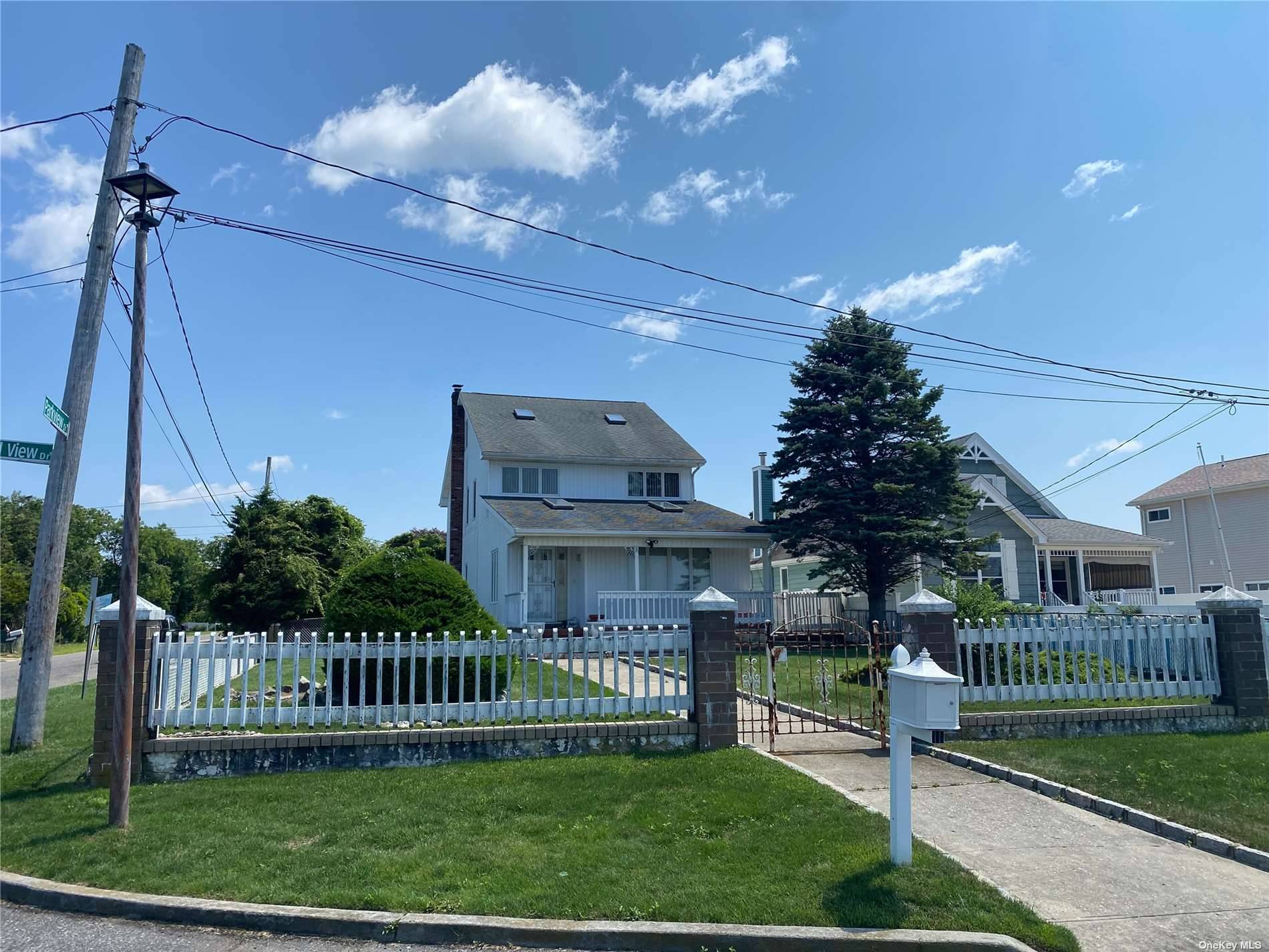 Beautiful contemporary style home on corner lot with magnificent views of the Bellport Bay.