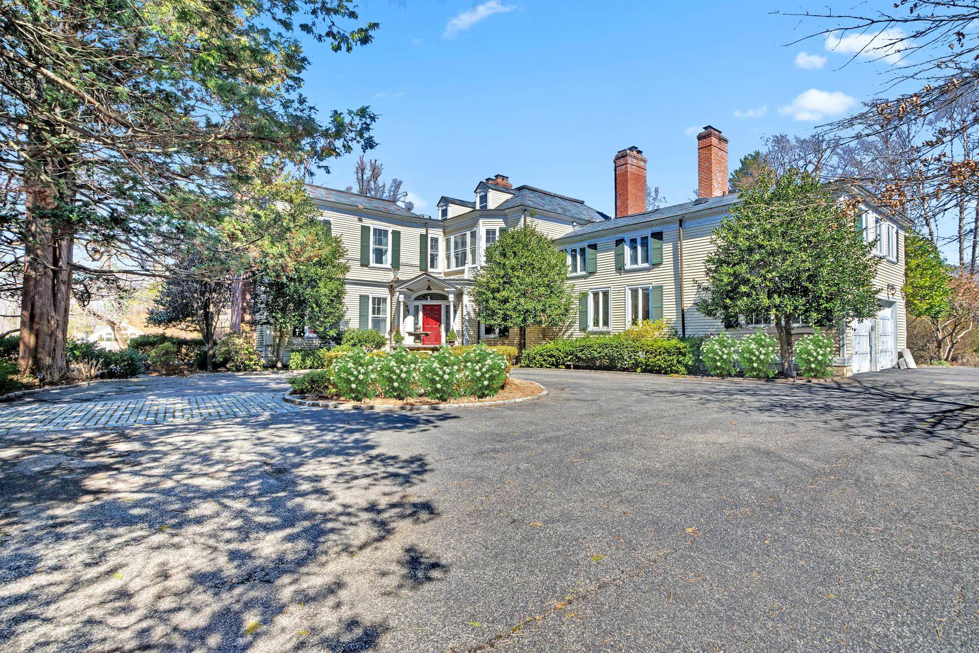 SANDS POINT PRIME LOCATION Colonial Estate with water and Manhattan views from private yard.