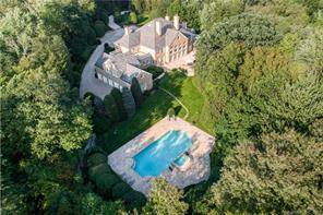 Classic elegance defines this extraordinary custom built Georgian Manor poised on 14 exceedingly private acres in coveted Conyers Farm featuring double gated entry, long winding drive, expansive stone terrace and ...