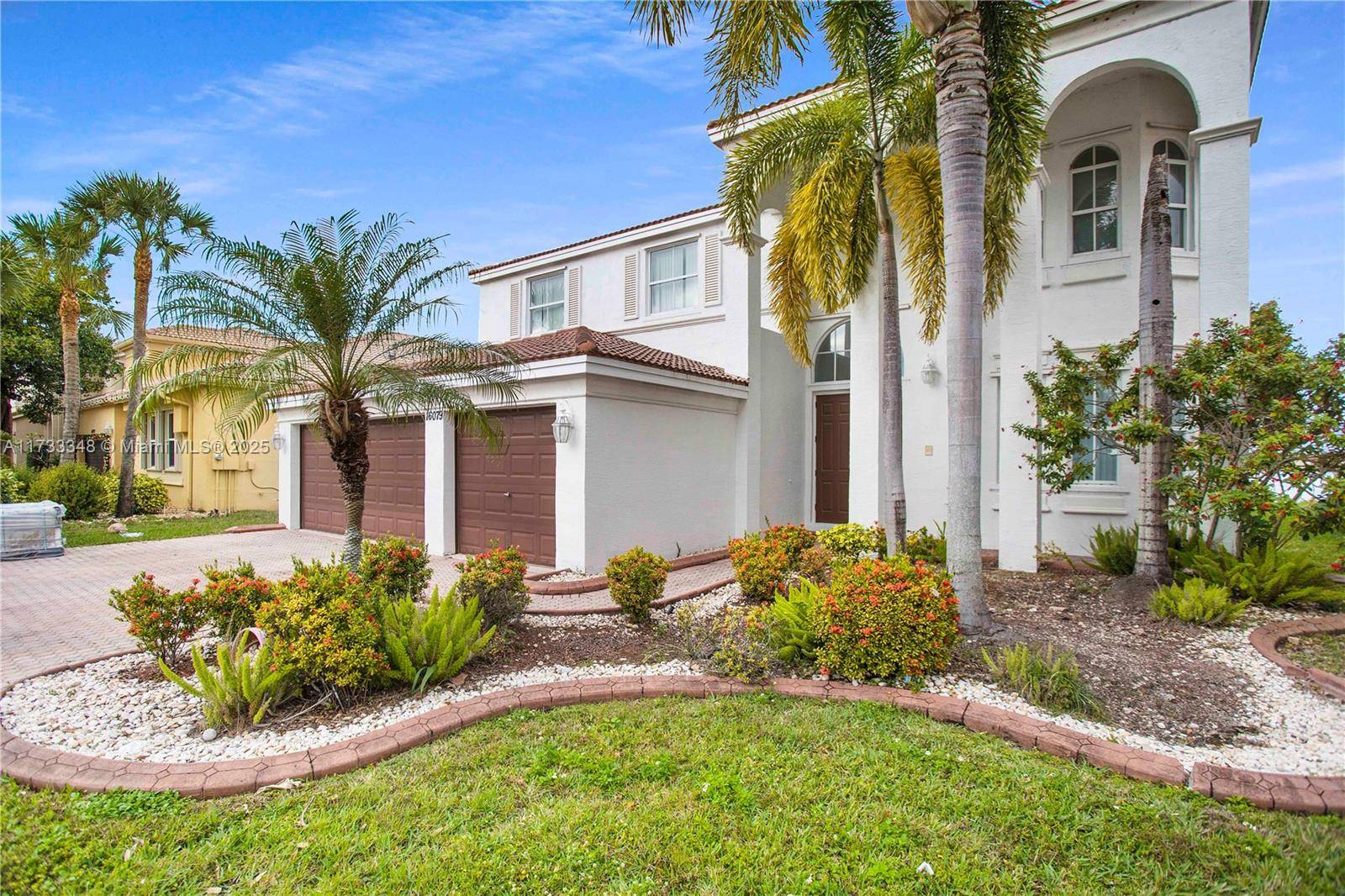 Stunning lakefront estate in prestigious Riviera Isles !