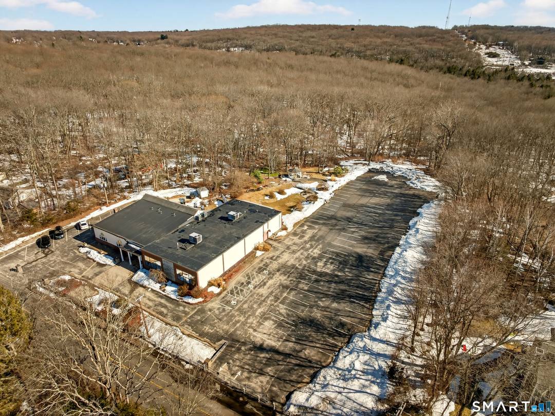 Rare opportunity to acquire a quality constructed single level commercial building situated on nearly 6 acres with beautifully maintained grounds and a distinguished setting.