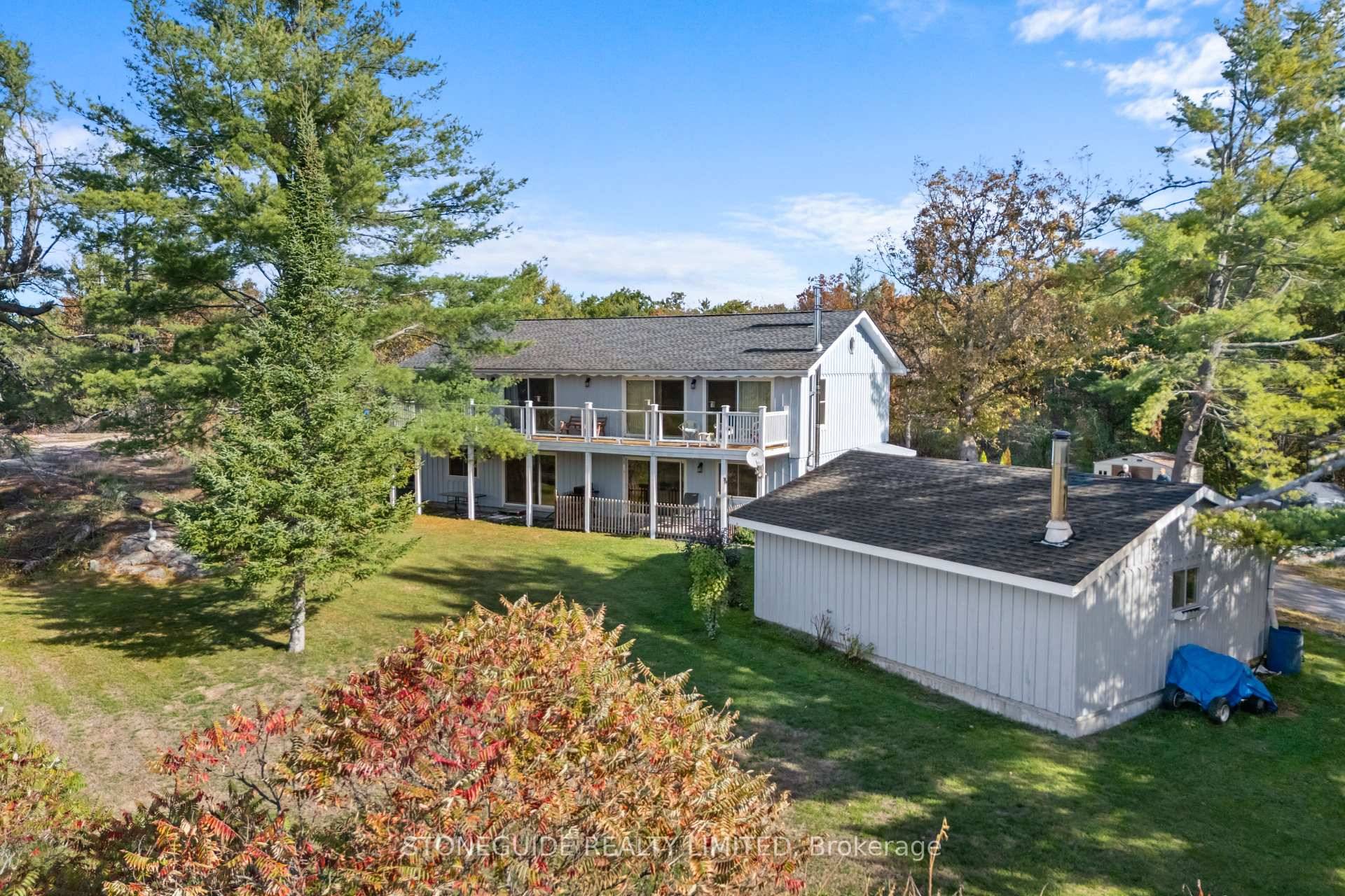 Discover the perfect blend of privacy, comfort, and natural beauty in this charming country bungalow set on 1.