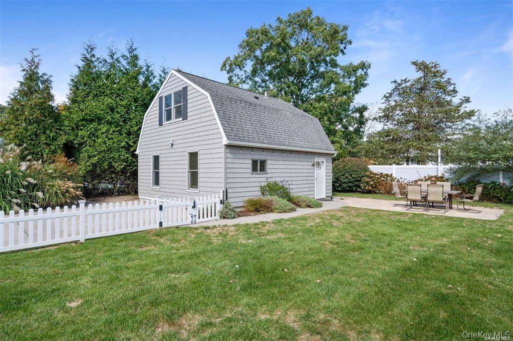 Located on a quiet lane in Hampton Bays, this charming year round rental offers a rare combination of privacy, outdoor space, and proximity to both bay and ocean beaches.