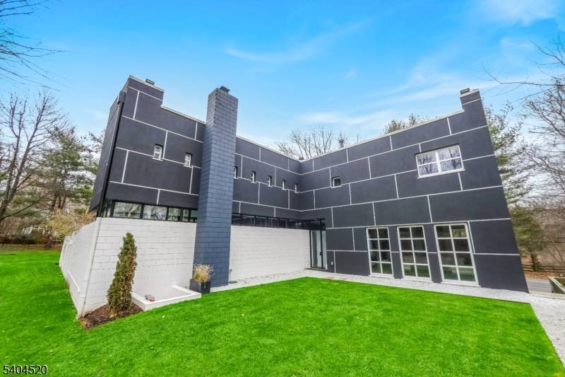 A rare architectural statement set amid serene privacy and expansive grounds, this extraordinary residence by UKZ Architects introduced Modernism to North Caldwell just 19 miles from New York City.