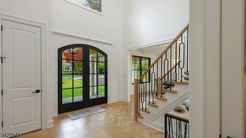 Welcome to this exceptional center hall colonial where timeless design meets modern luxury, set on a rare 1 acre level lot.