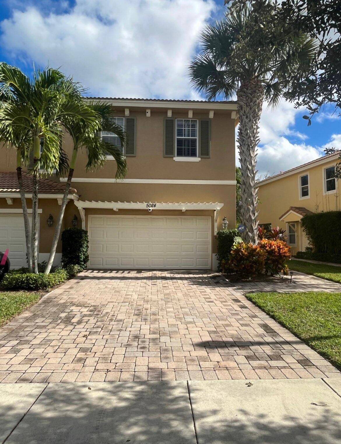 Lovely 3 BR end unit townhome located on an extra large lot w landscaped fenced yard spacious brick paved lanai in the highly sought after gated community of Paloma.