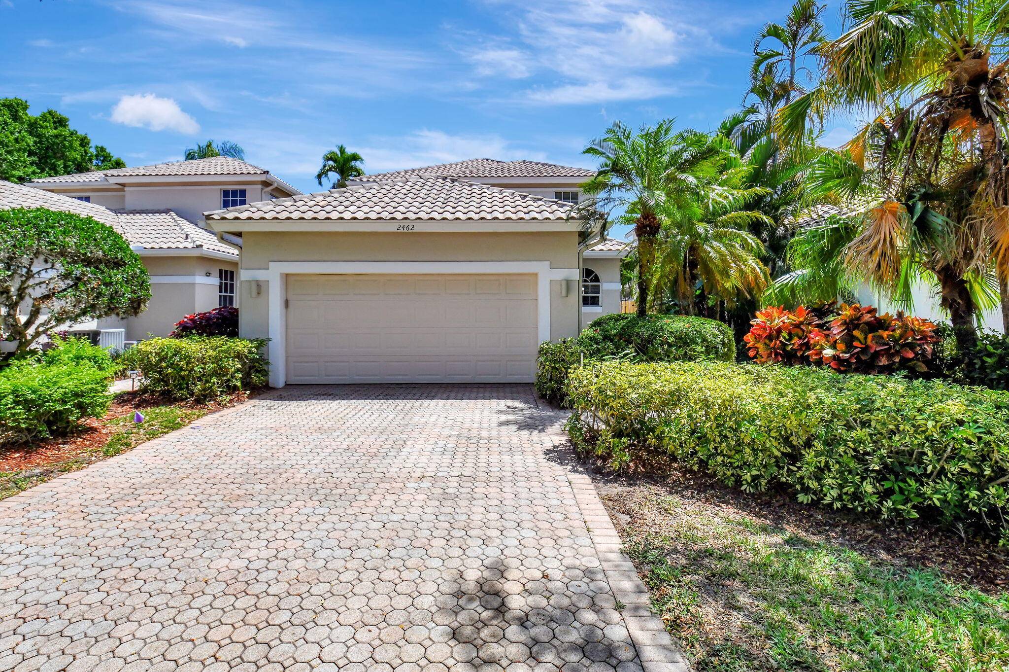 Welcome to your dream home in the sought after Village of the Banyans, nestled within the prestigious Broken Sound Country Club.