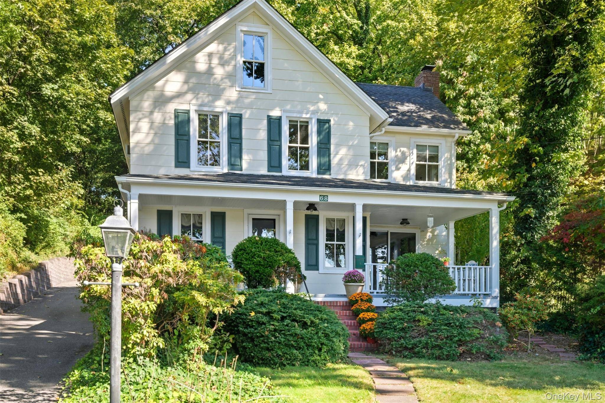 Perched in the gateway to Huntington Bay, this charming vintage Colonial offers timeless appeal with modern comfort and stunning views of Huntington Harbor.