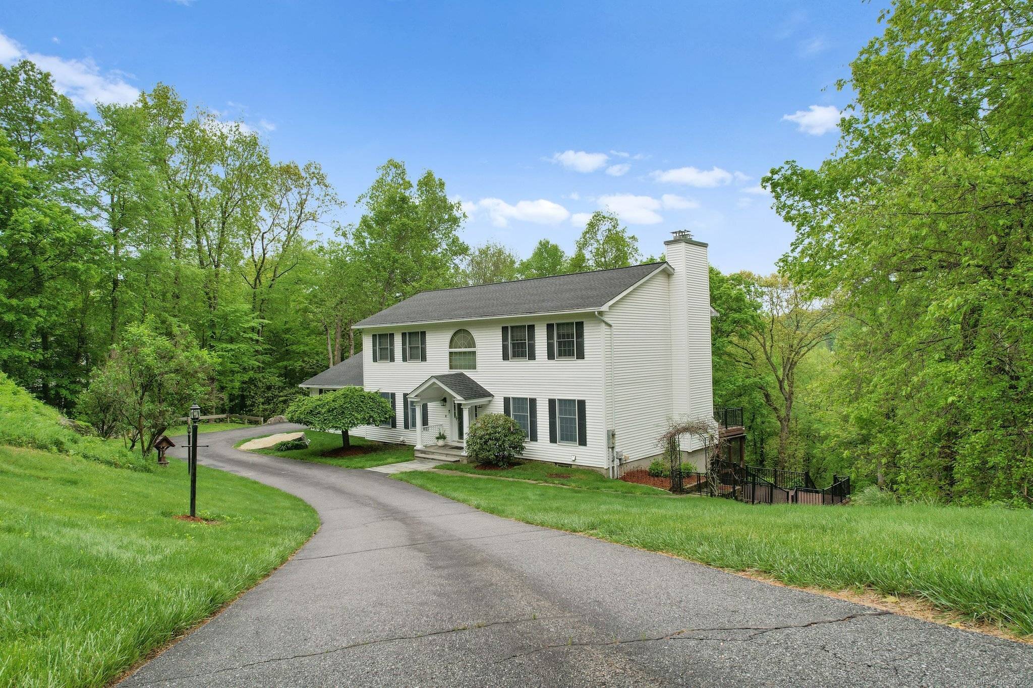 Welcome to 8 Austin Drive a private oasis tucked away on a peaceful cul de sac street !