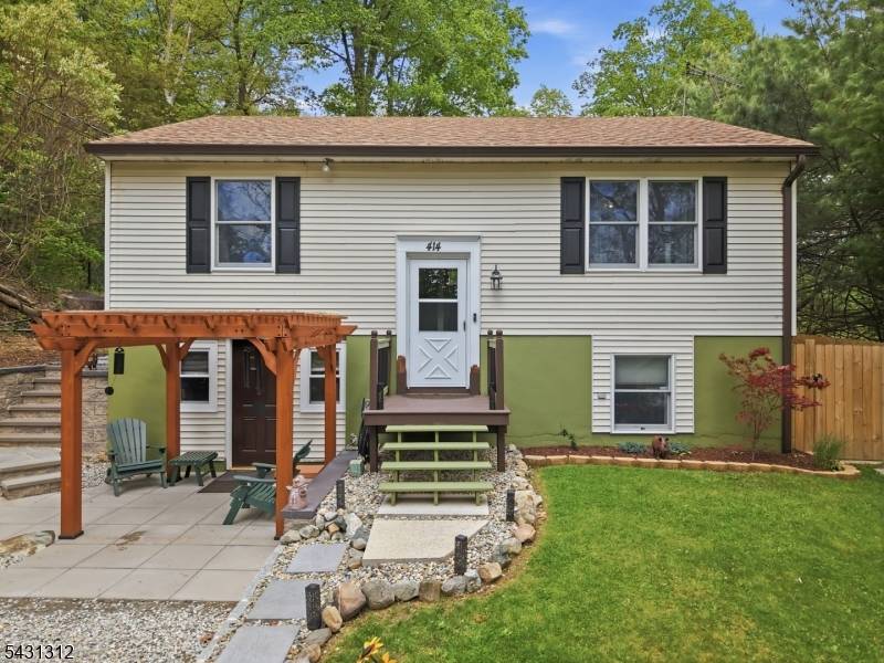 Renovated and thoughtfully updated, this move in ready bi level home offers the perfect combination of space, comfort, and modern style on a scenic 1.