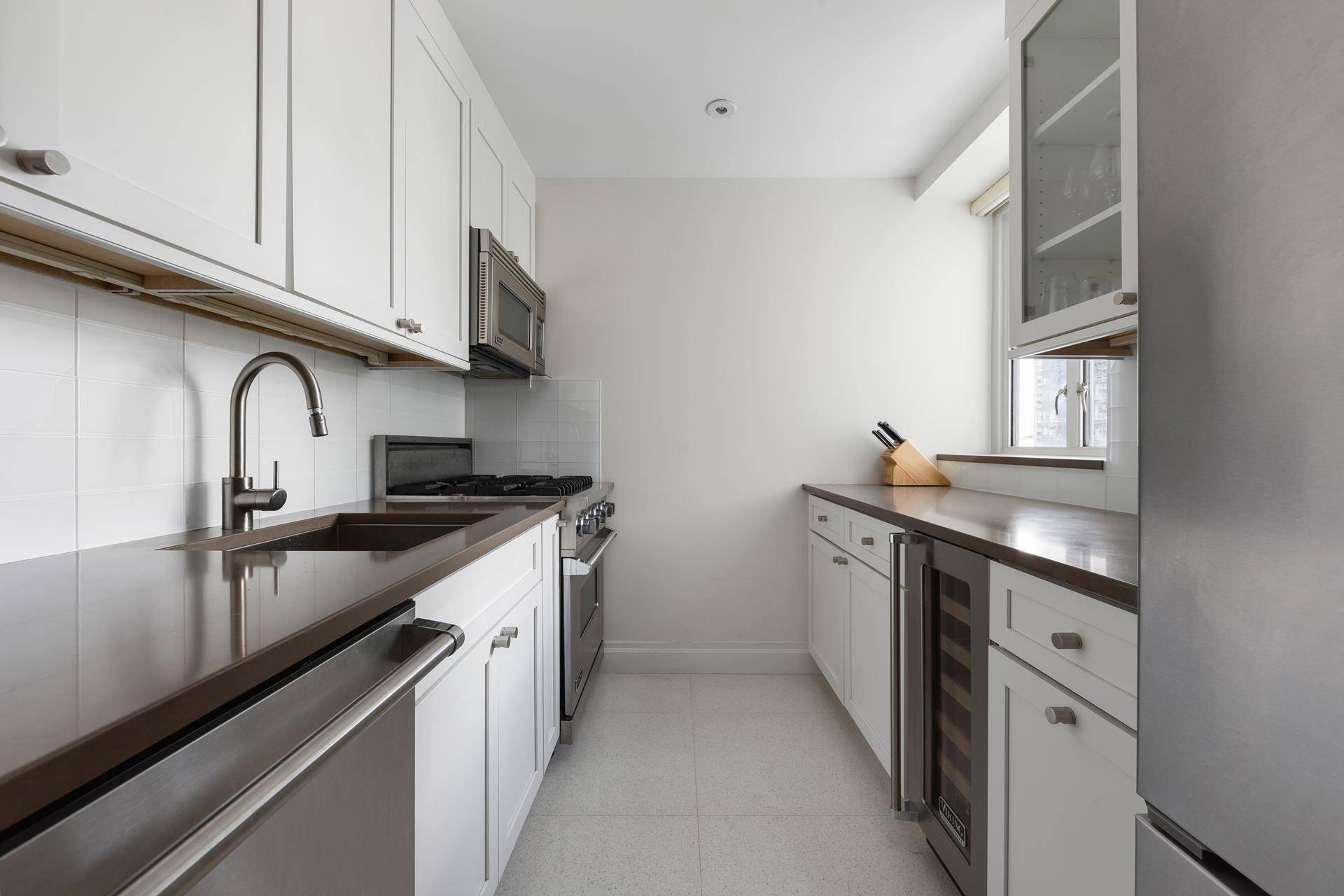 The fully renovated 2 bed, 2 bath with terrace at the highly coveted Manhattan House is offered furnished with all restoration hardware furniture.