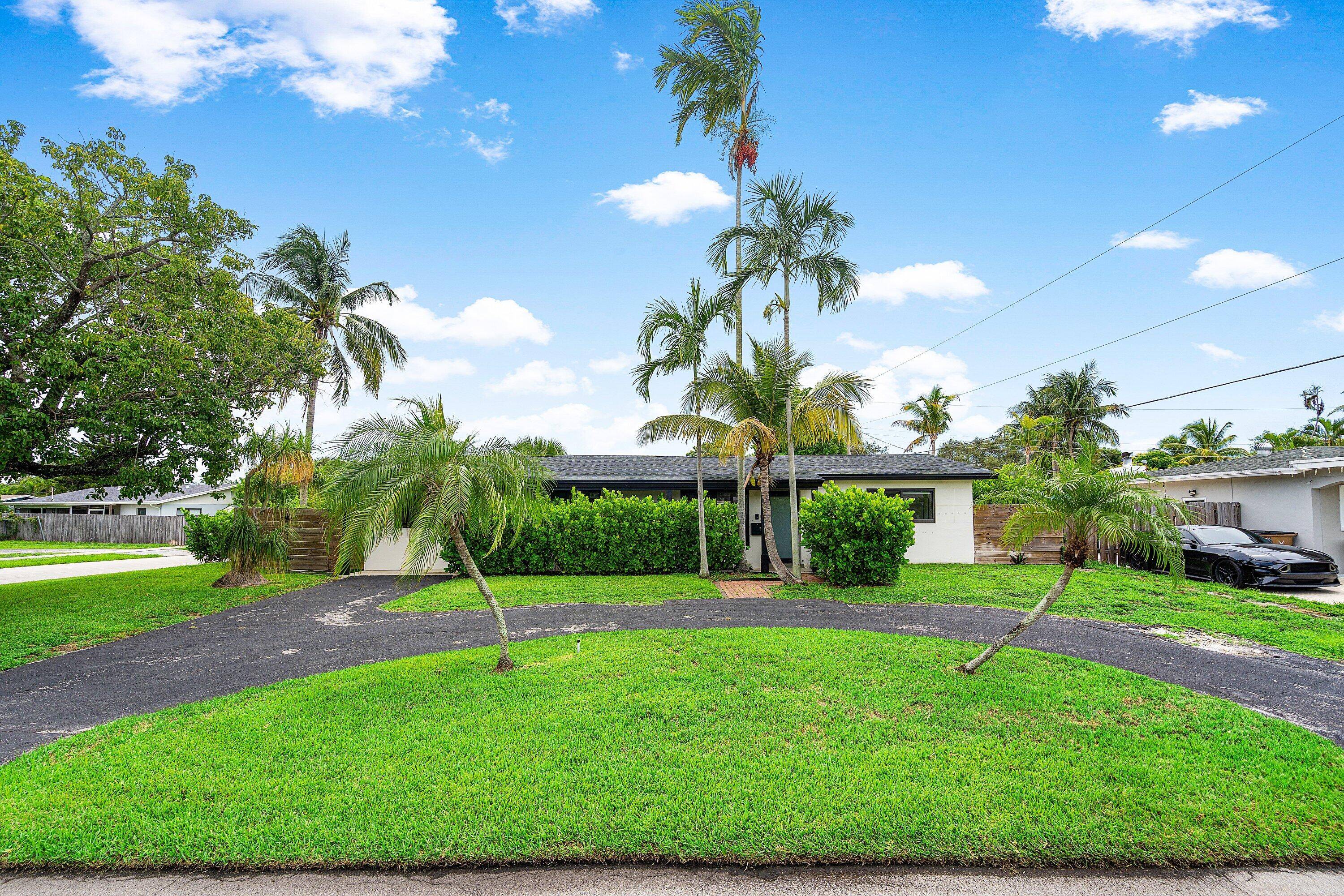 Welcome to this ultra modern 4BR 2BA home on a fully fenced corner lot in east Deerfield Beach.