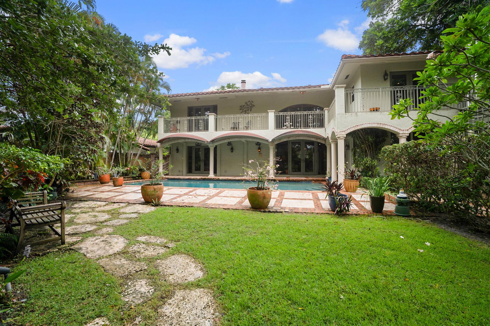 Exquisite Waterfront Estate with Private Dock in The Historic Old Floresta Area.