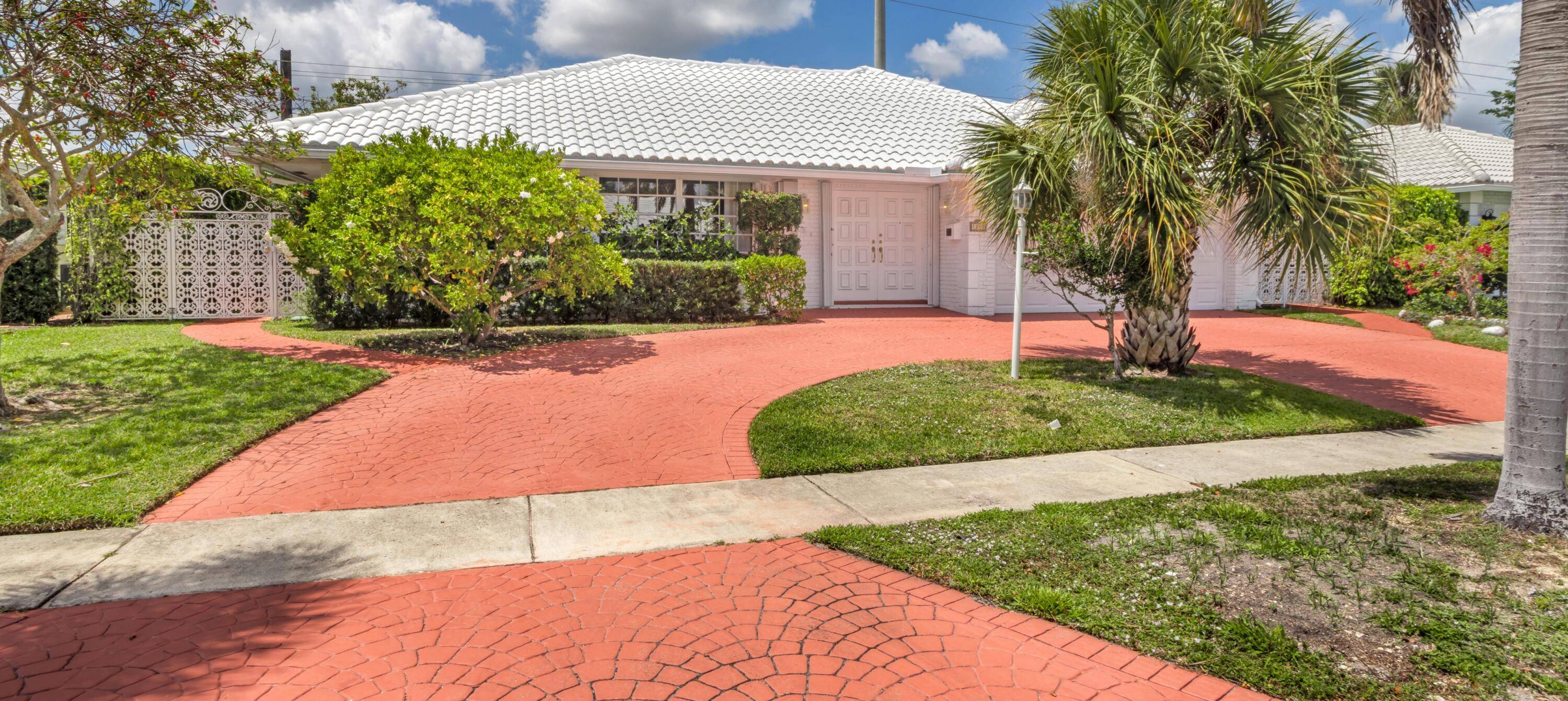In east Boca Raton's sought after Camino Gardens enclave, this residence features a sun filled, flowing layout with a living room and formal dining area.