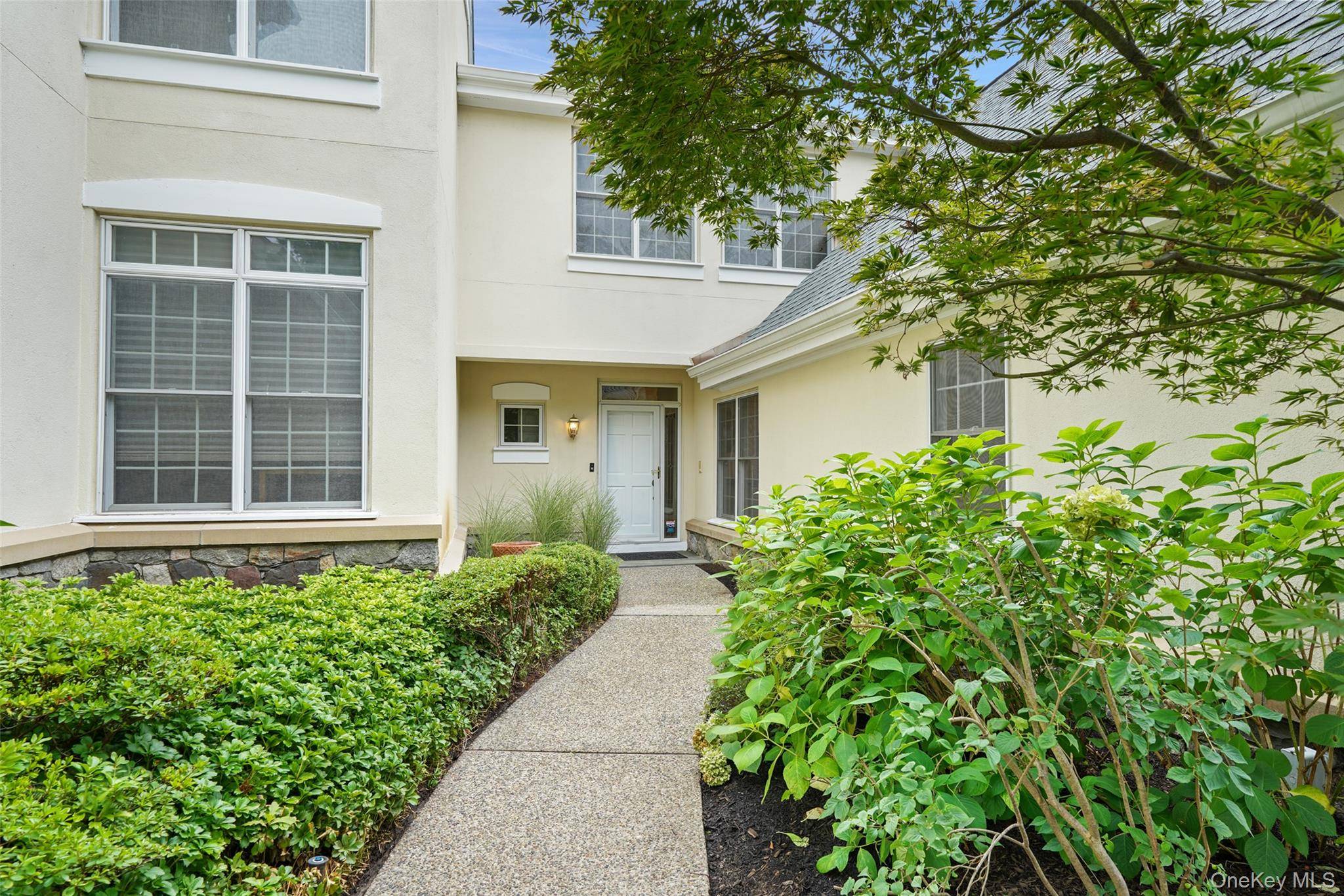 Step into effortless elegance in this beautifully appointed townhouse in the prestigious Doral Greens community.