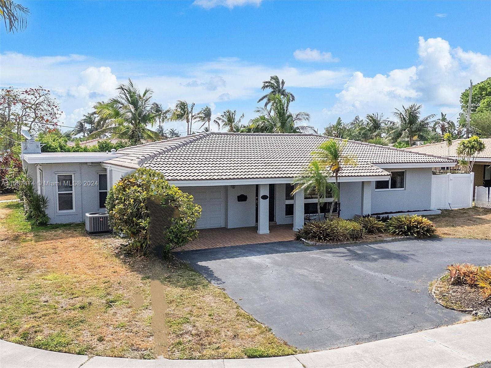 Gorgeous 3 bedrooms 2 bathrooms Renovated home with pool located on an oversized corner lot.
