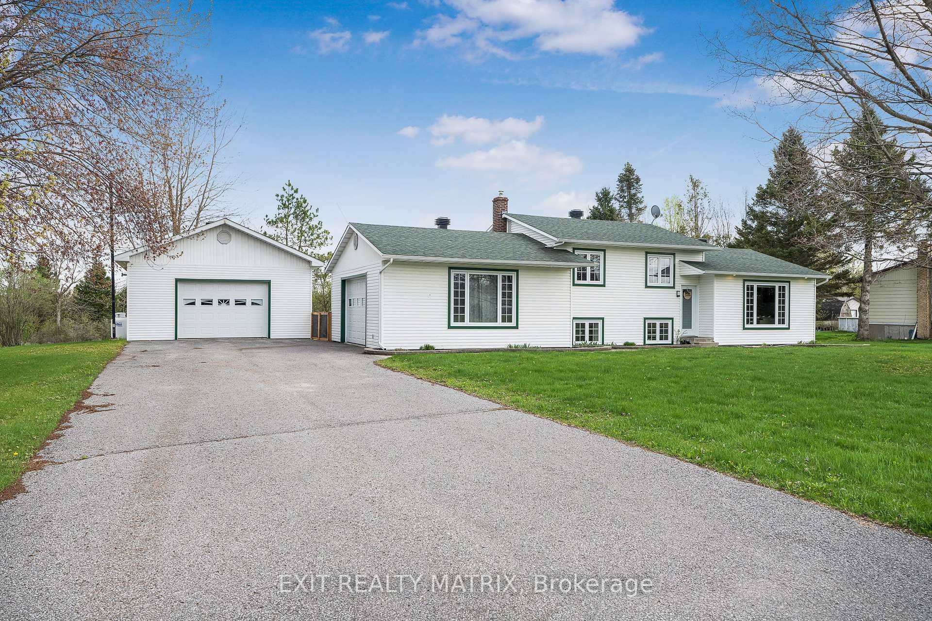 Move In Ready Side Split with Modern Upgrades and Exceptional Garage Space !
