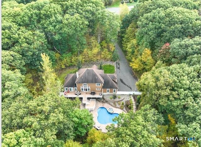 This Pristine Secluded Custom built Home offers 3, 654 square feet of Magnificent Living Space on 1.