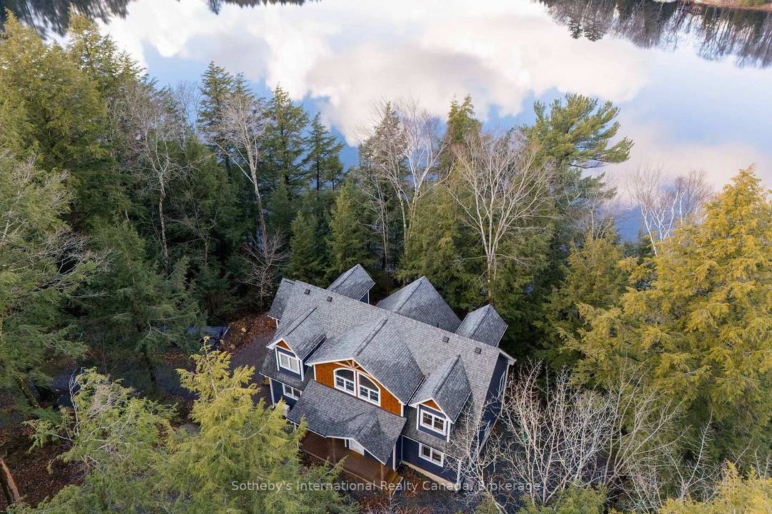 Custom built, two storey cottage retreat on family friendly Ricketts Lake in the heart of Muskoka.