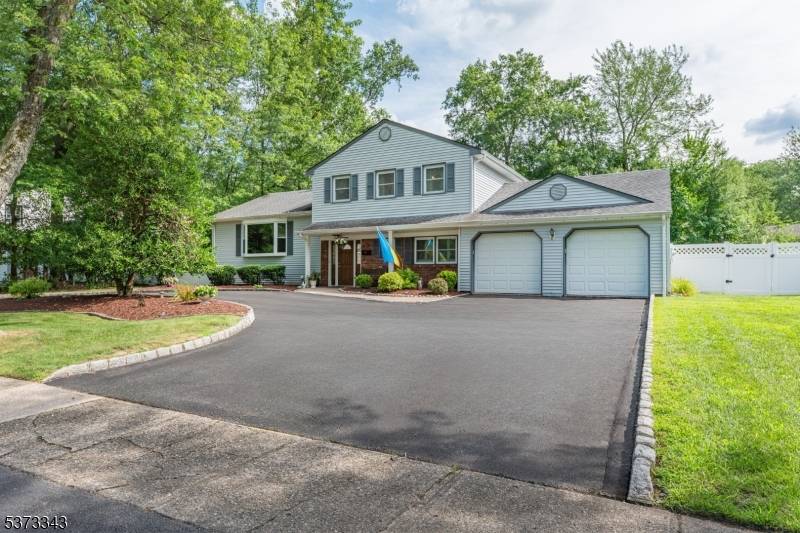 Welcome to 15 New England Drive, a stunning and well maintained Colonial Split level home, offering 4 bedrooms and 2.