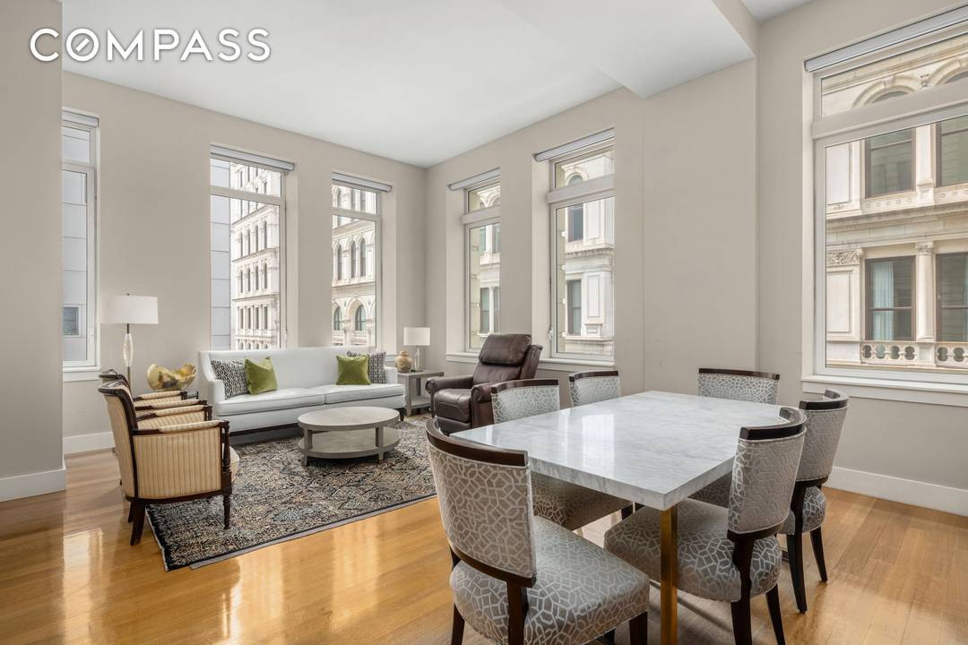 Residence 2E at The Leonard is a meticulously crafted three bedroom, three bathroom loft spanning nearly 2, 000 square feet, bathed in natural light from sweeping south and east exposures.