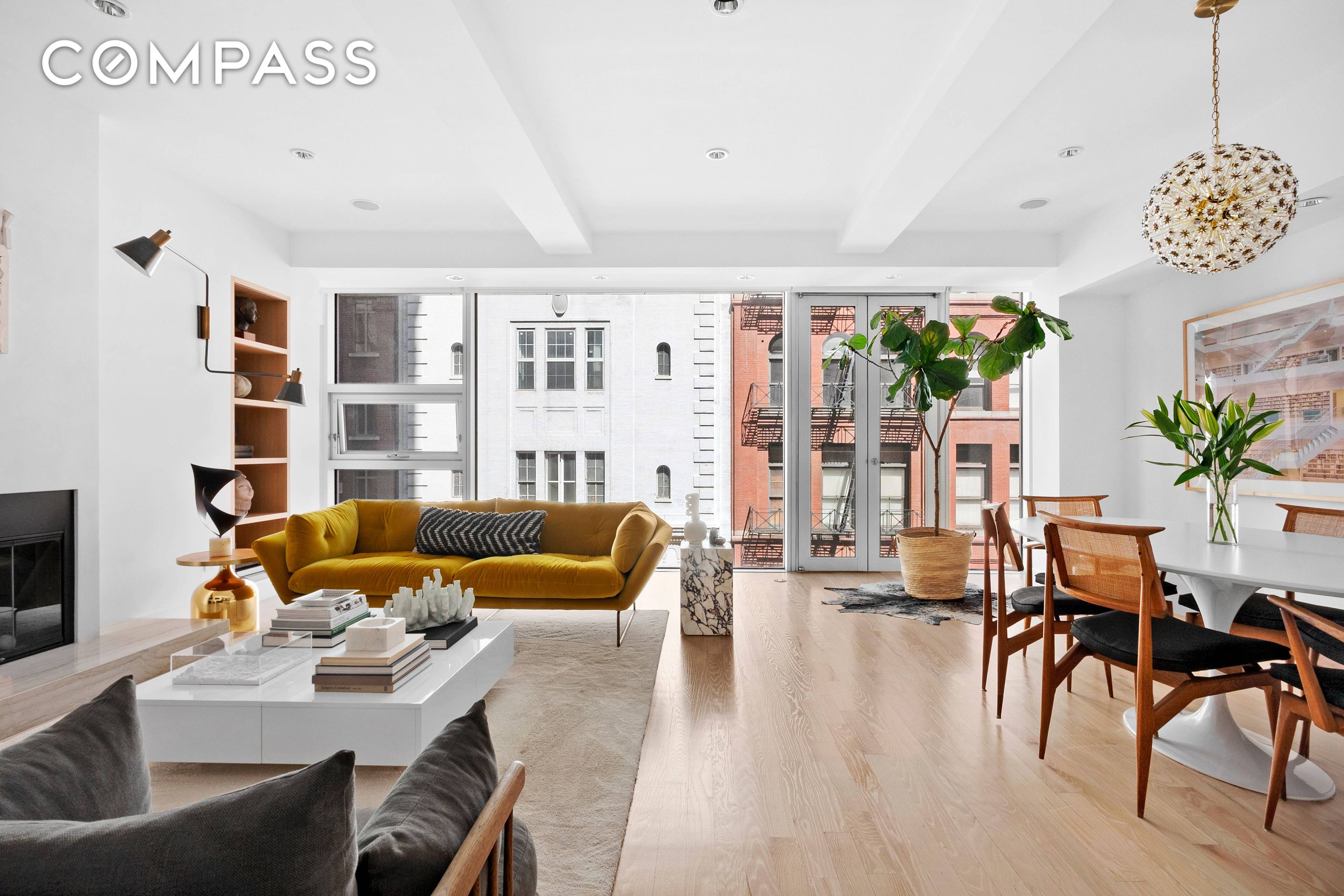 This stunning floor through two bedroom, two bath home was renovated and redesigned to the highest standards and offers the perfect combination of loft style living with a modern aesthetic.