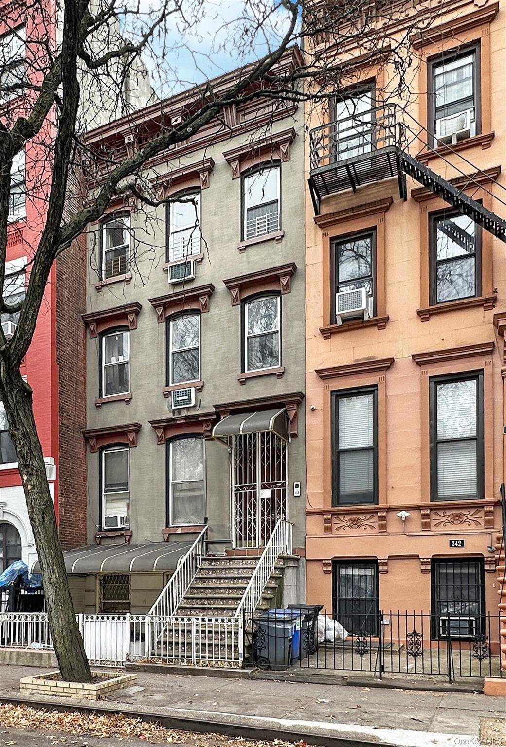 Solid brick three family townhouse in the heart of East Harlem, offering a total of 8 bedrooms and 4 full bathrooms.