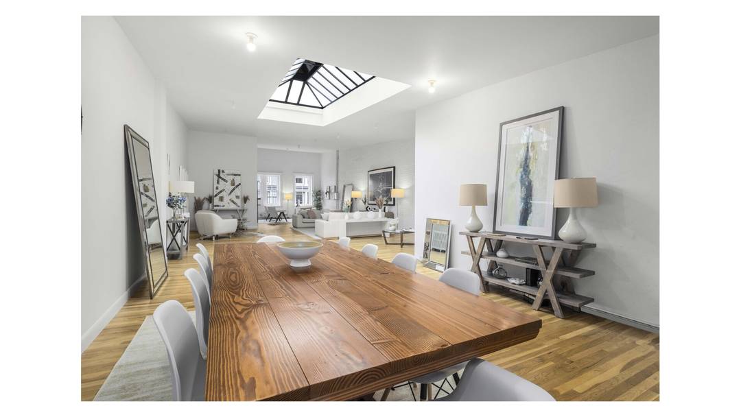 This classic full floor SoHo loft is the very definition of loft living complete with a delightful private roof area offering sweeping Soho views.