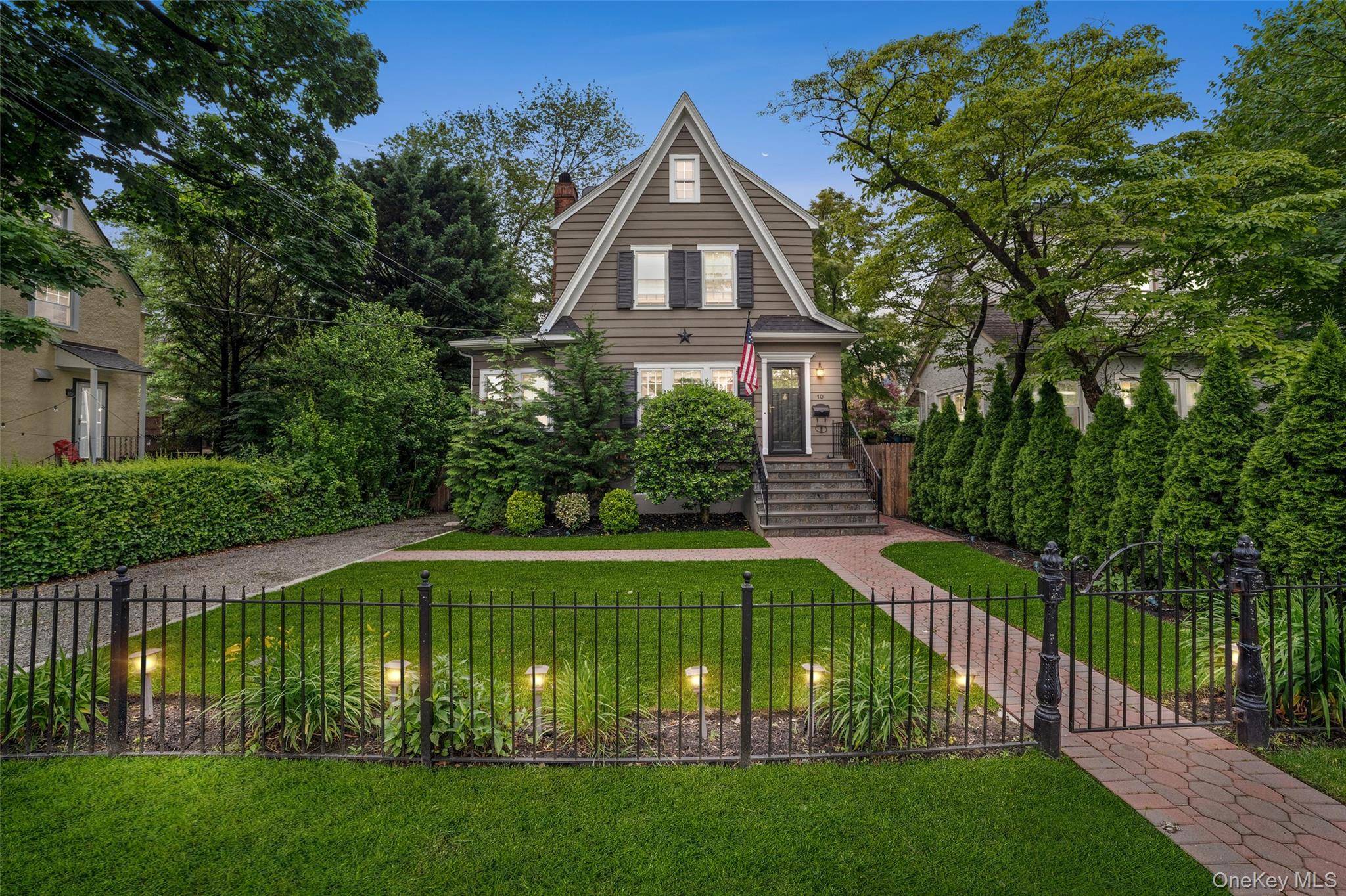 Welcome to this charming and light filled Colonial nestled in the heart of Bronxville.