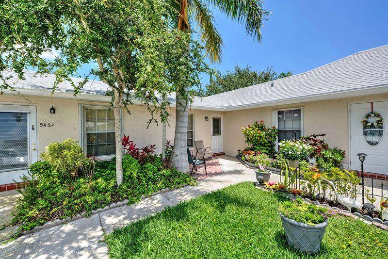 Desirable corner unit, 2 bedroom, 2 bath, spacious living area with sliding glass doors opening to enclosed patio with storage closet.