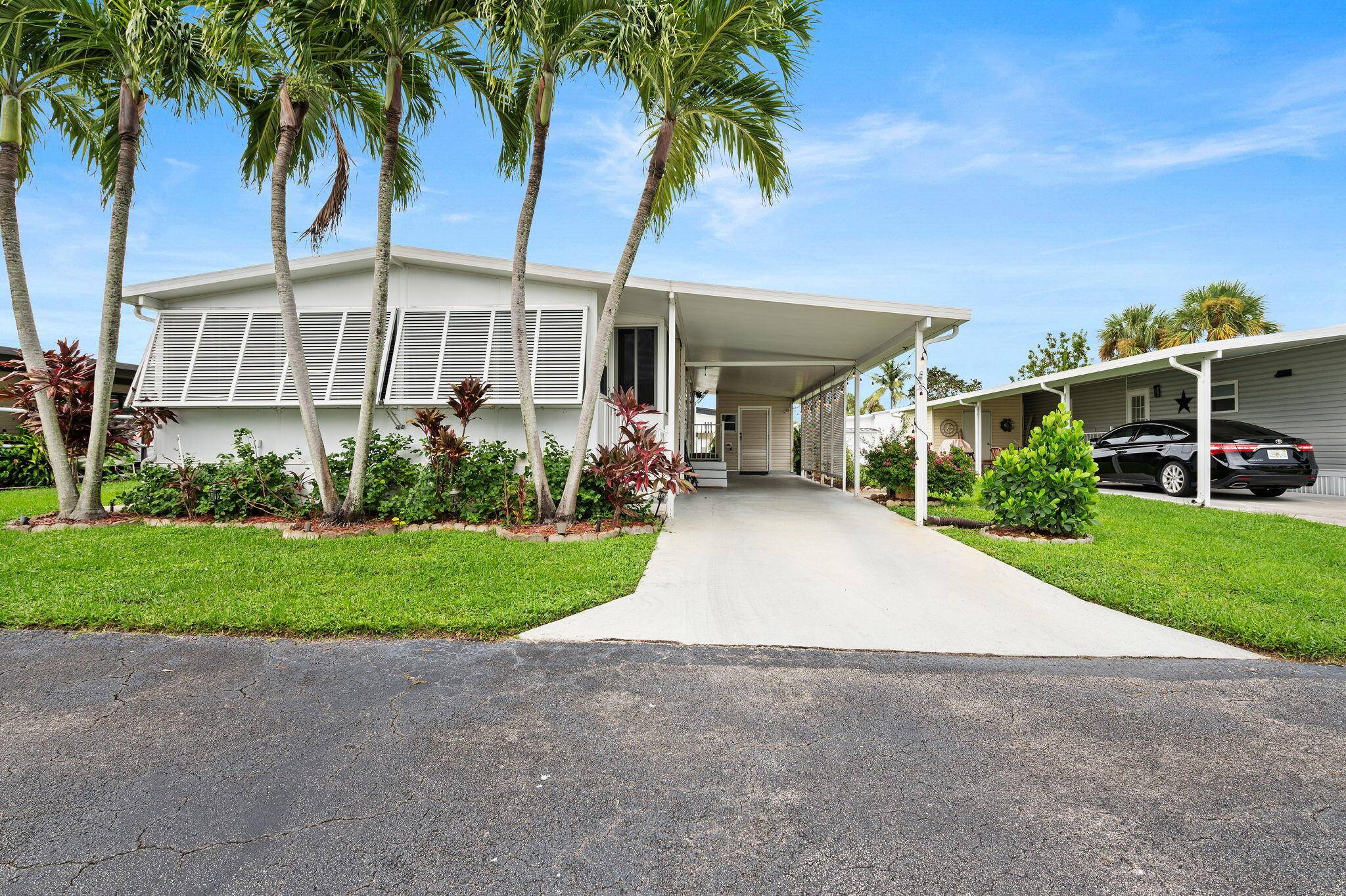 Completely Furnished Turnkey 2 Bedroom, 2 Bath Home in Gated Jamaica Bay Community.