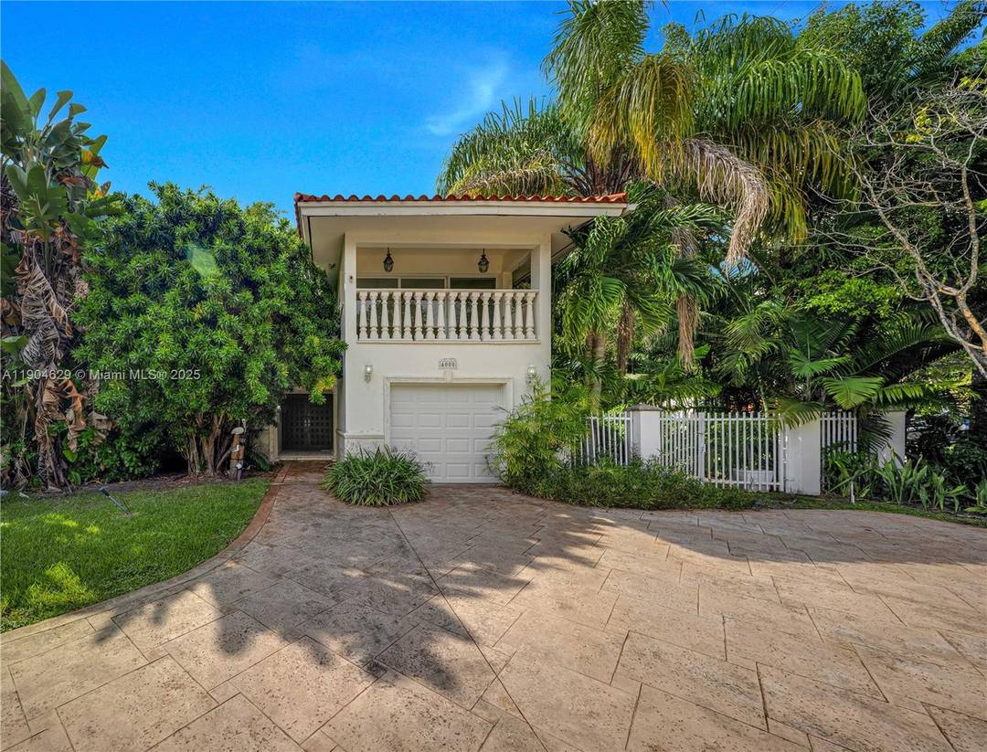 Bright amp ; spacious 2 story home on a desirable corner lot in the heart of Coral Gables, located on prestigious Alhambra Circle.
