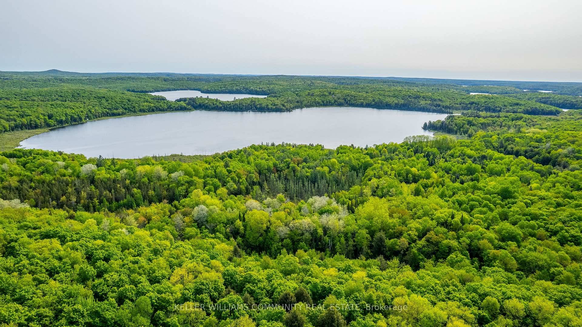Welcome to 1304 Lower Monmouth Lake Road, a rare and expansive 214 acre waterfront parcel nestled in the heart of Ontario's cottage country.