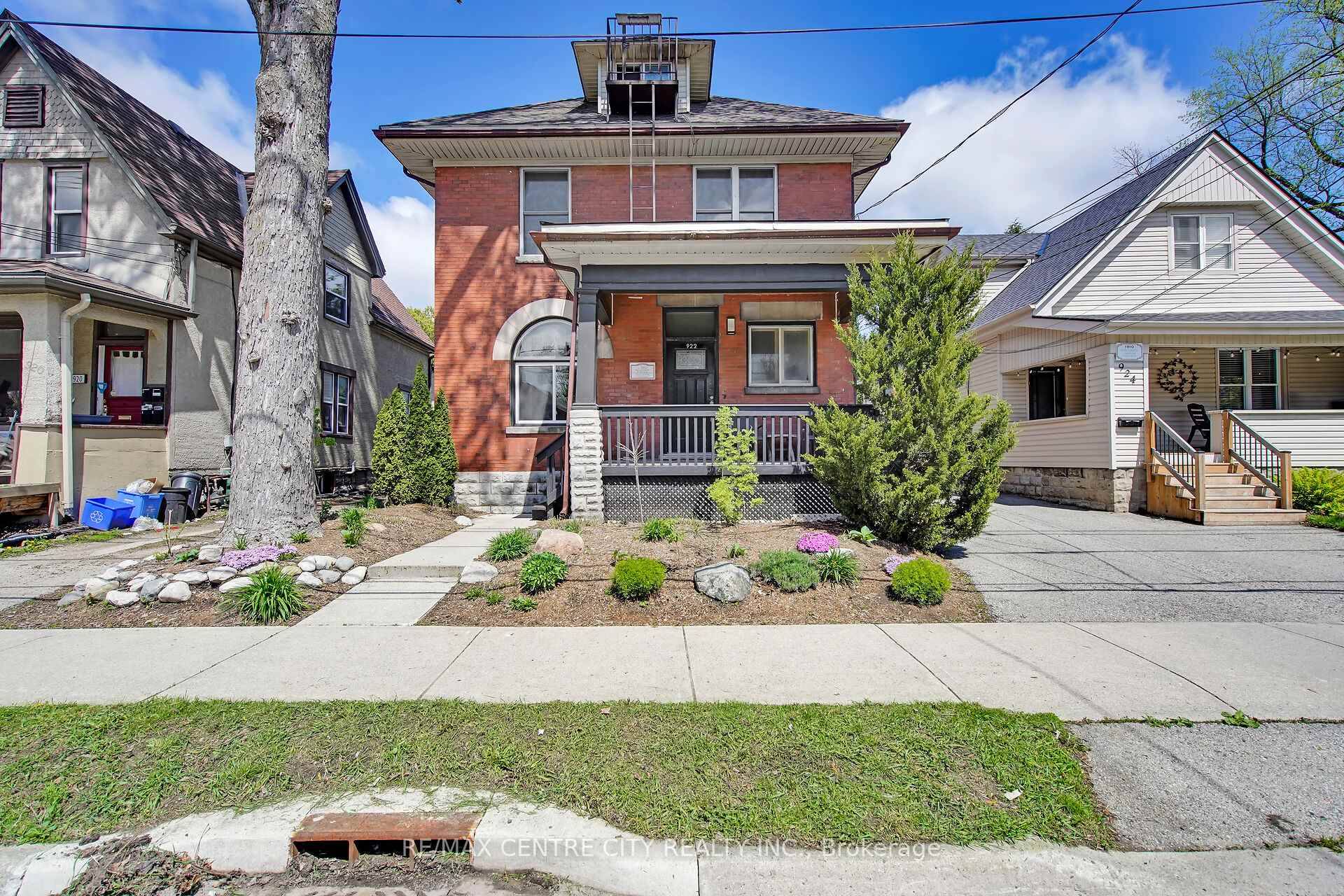 Opportunity knocks in the heart of Old East Village with this beautiful, well maintained red brick fourplex offering excellent curb appeal, manicured landscaping, and a welcoming front porch.