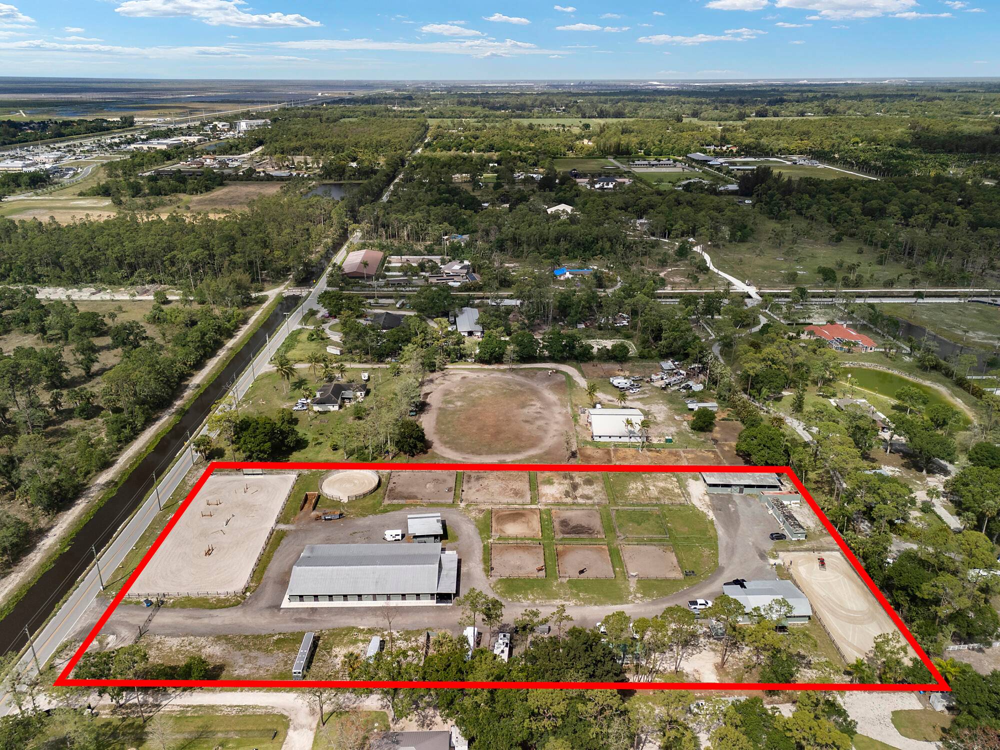 Welcome to Twisted Spurs Farm ideally located in the desirable equestrian community of Loxahatchee Groves, This completely and totally renovated 5 acre elevated grade commercial residential farm has it all, ...