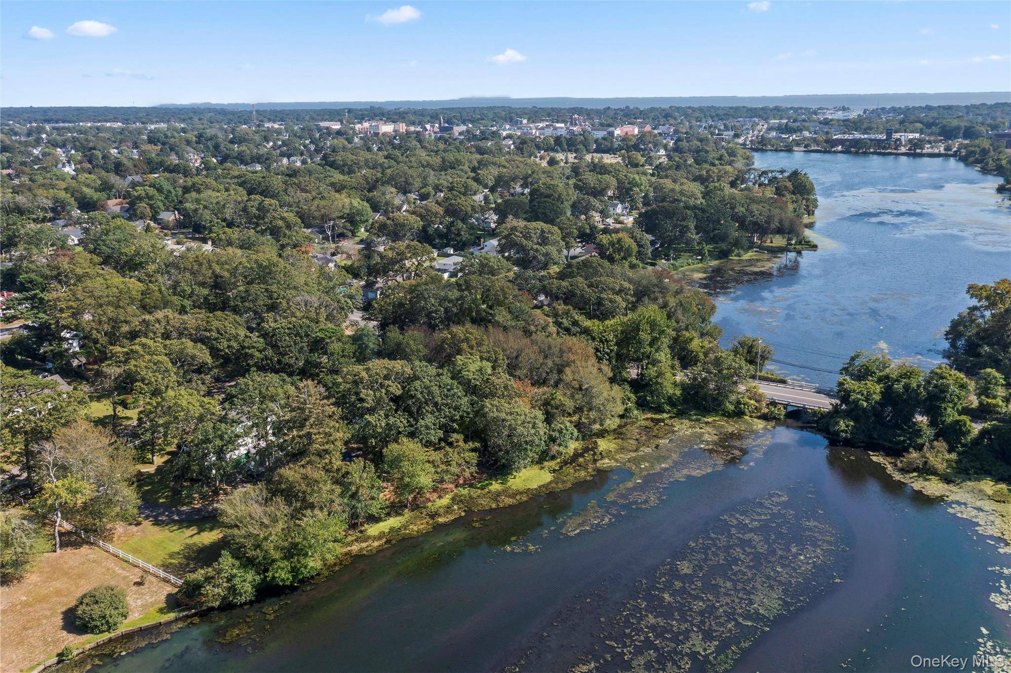 A rare opportunity to own a 1 acre waterfront property on Great Patchogue Lake, offering 200 feet of private water frontage and sweeping year round views.