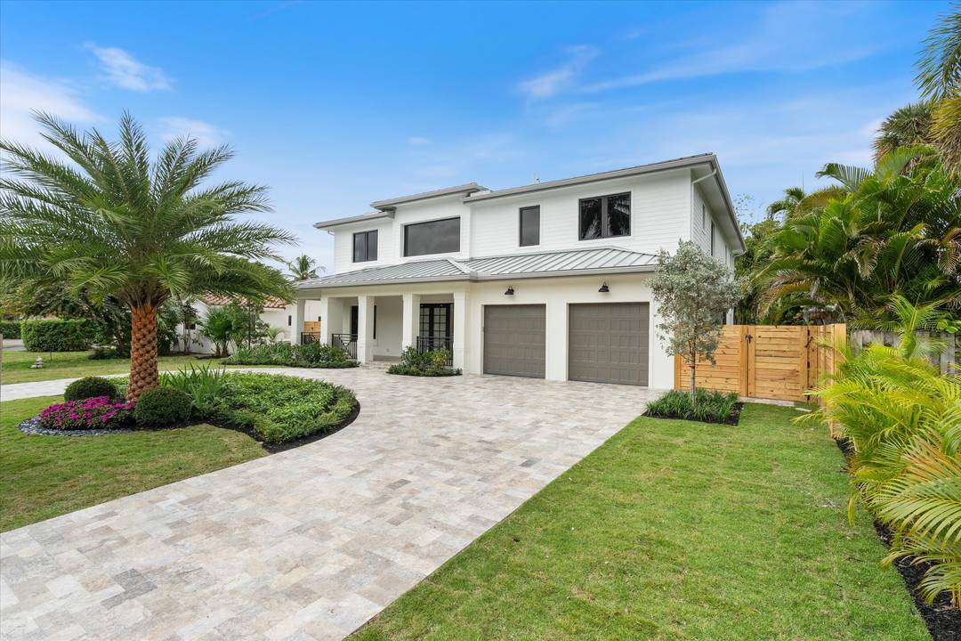Stunning Modern Key West new construction showcasing a dramatic foyer with circular staircase that welcomes you to the expansive living room with 23' ceilings and an entire wall of glass ...