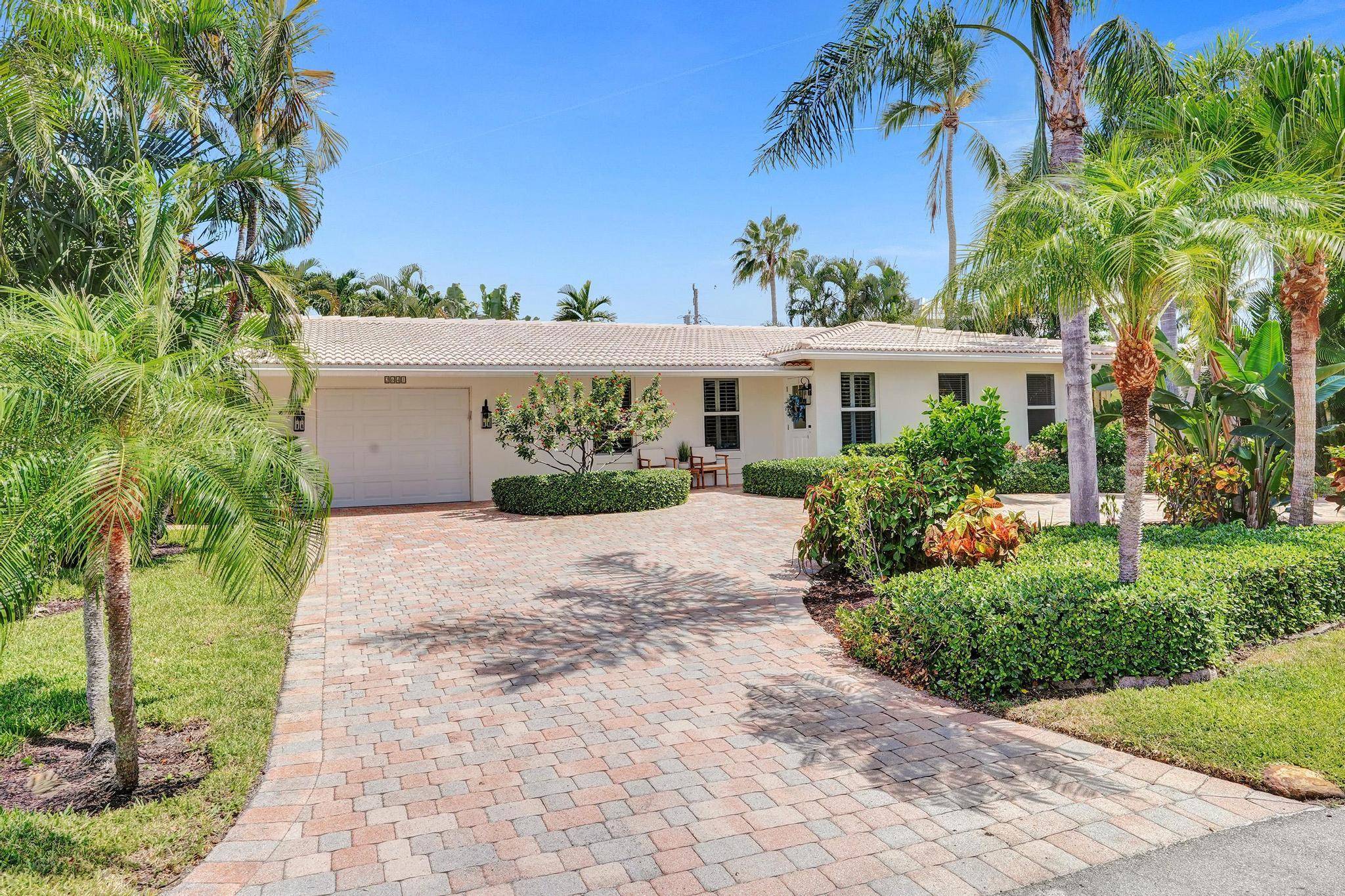 Welcome to this masterfully renovated pool home, where timeless charm meets modern luxury.